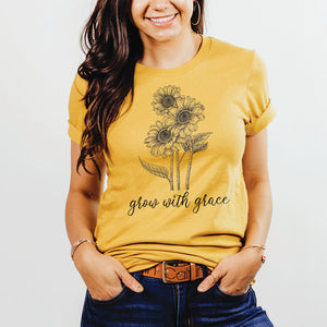 Relaxed woman in jeans wearing the grow with grace Christian top