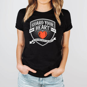 Guard your heart t-shirt in black worn by young woman in jeans