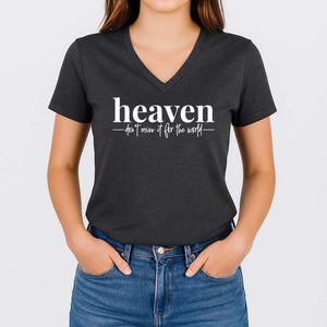 Person wearing a black V-neck t-shirt with 'heaven don't miss it for the world' text on a plain background