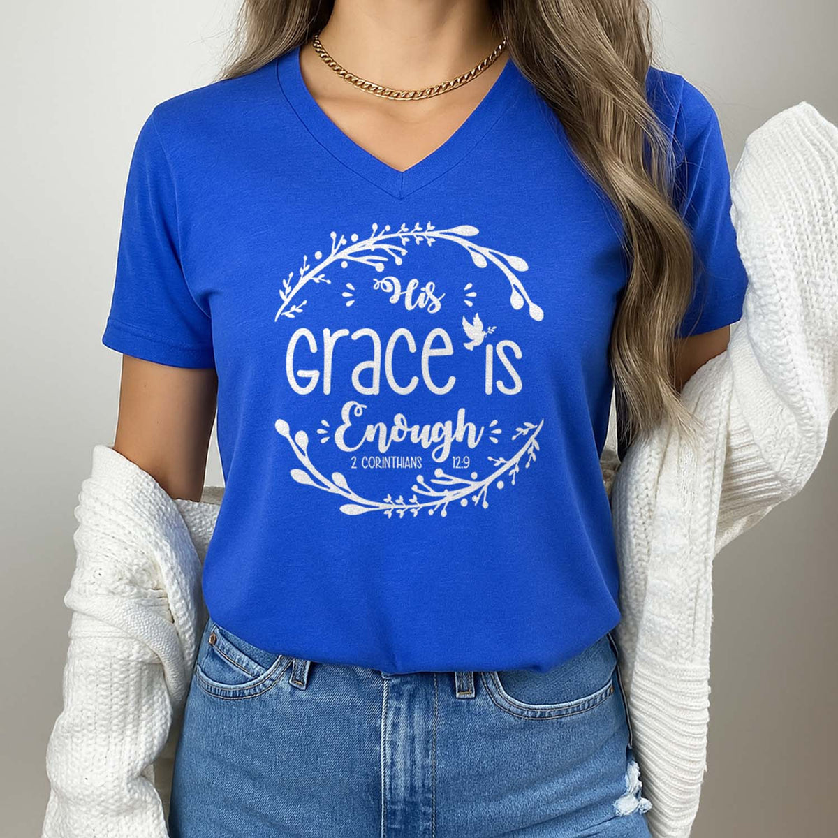 Woman wearing a blue t-shirt with 'Grace is Enough' text design