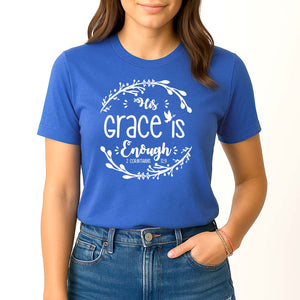Happy young woman wearing the royal blue His grace is enough top