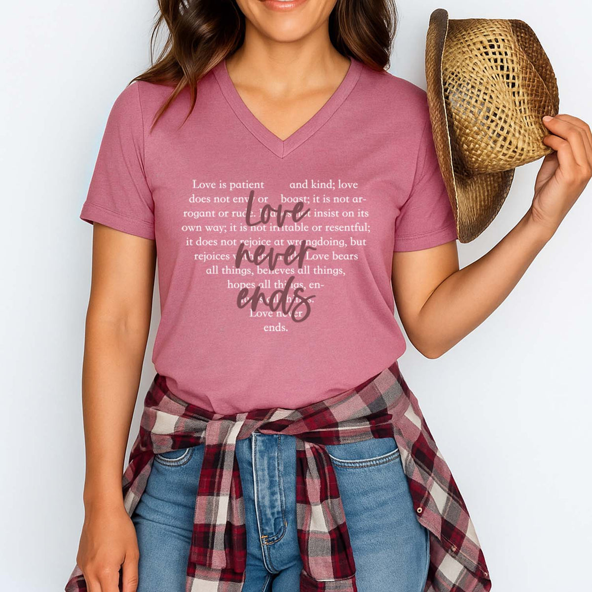 Woman wearing a pink t-shirt that reads love never ends
