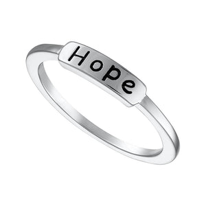 Delicate sterling silver band showcasing a clear inscription of 'hope'