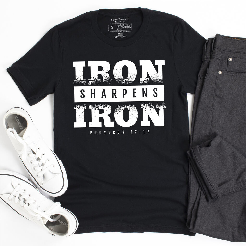 Bold statement shirt for men in black that states "iron sharpens iron" from Proverbs 27:17