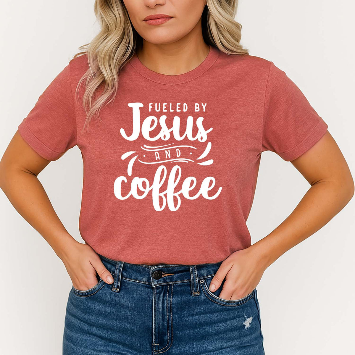Woman wearing a clay t-shirt with 'Fueled by Jesus and Coffee' text on a white background