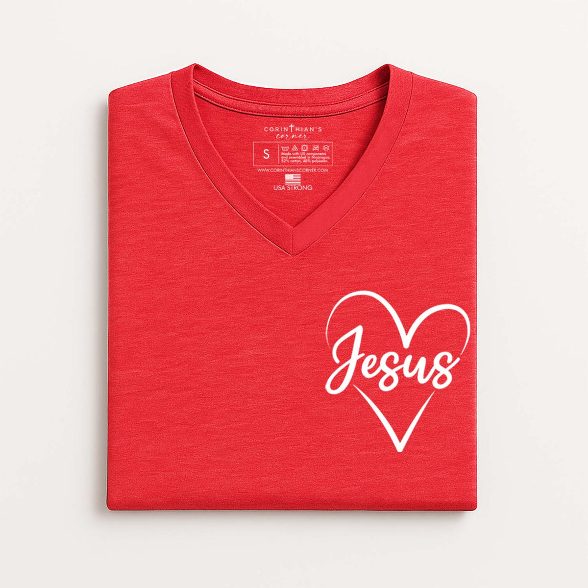 Red V-neck t-shirt with 'Jesus' in a heart shape on a white background