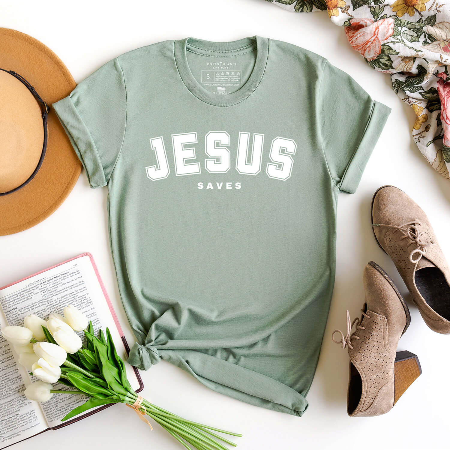 Jesus Saves collegiate style shirt in heather sage styled with flowers and a boho outfit