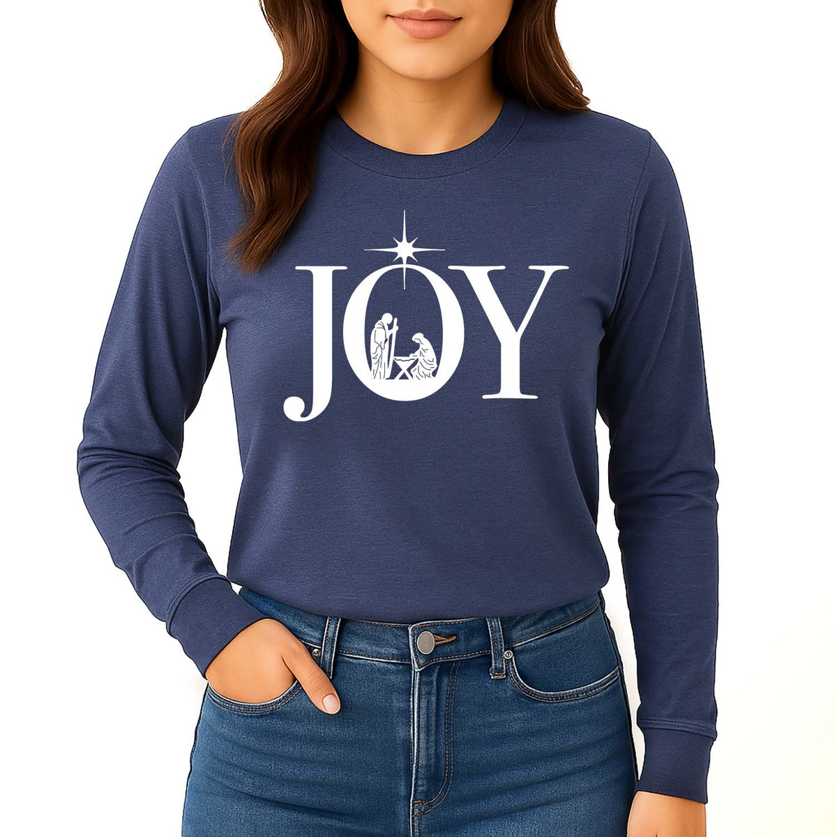 Navy long-sleeve shirt with 'JOY' and nativity design worn by a woman against a beige background