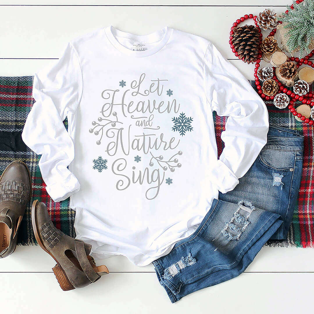 Bright white Christmas shirt that reads "let heaven and nature sing"