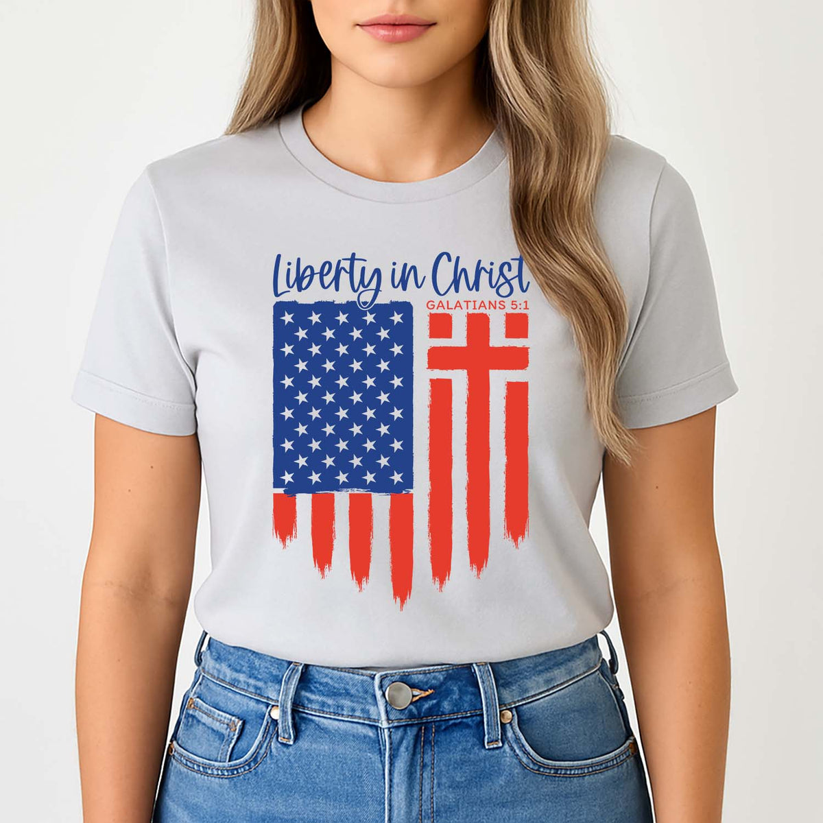 Smiling young woman wearing a patriotic liberty in Christ shirt referencing Galatians 5:1