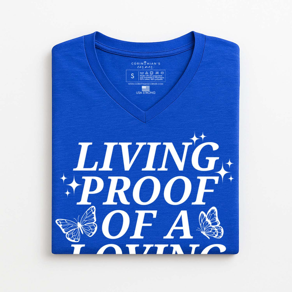 Blue V-neck t-shirt with butterfly graphics and white text that reads living proof of a loving God