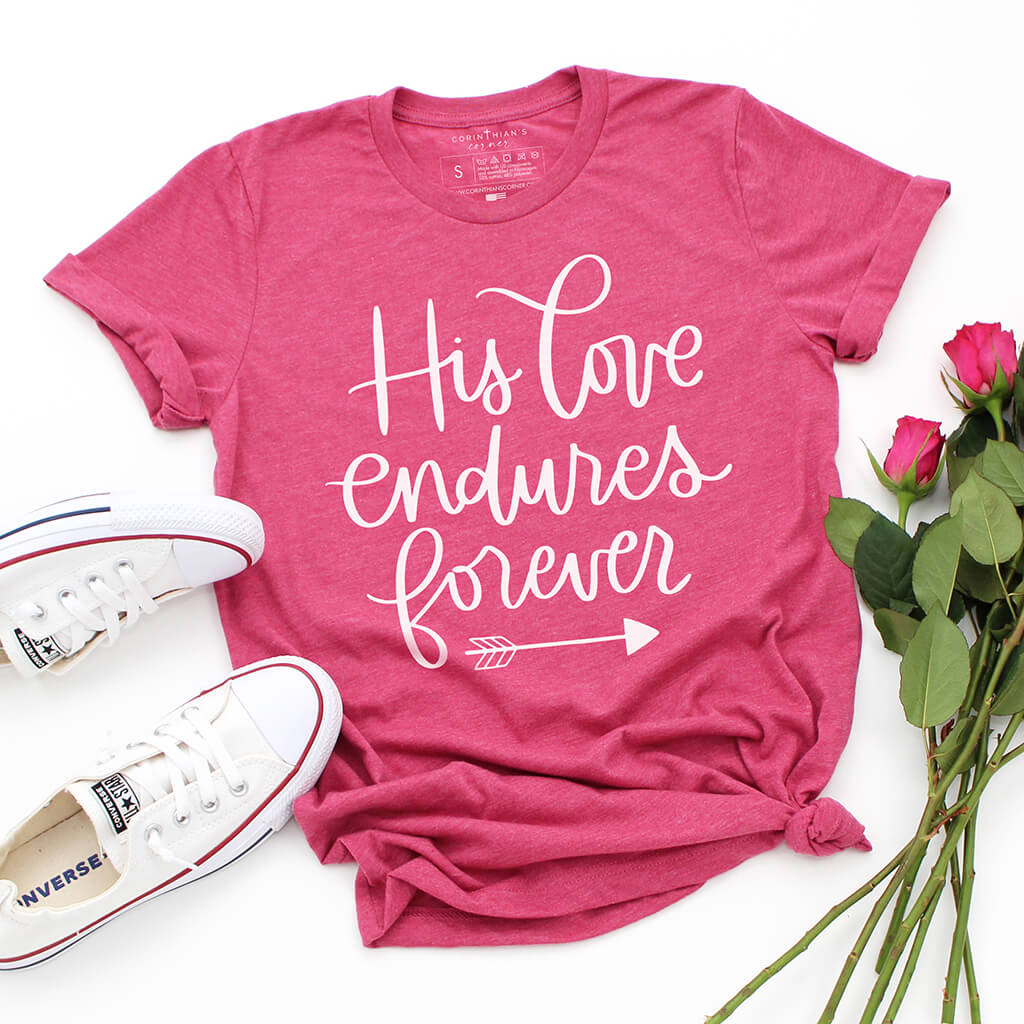 Vibrant pink t-shirt with 'His Love Endures Forever' written in white lettering to celebrate Psalm 136