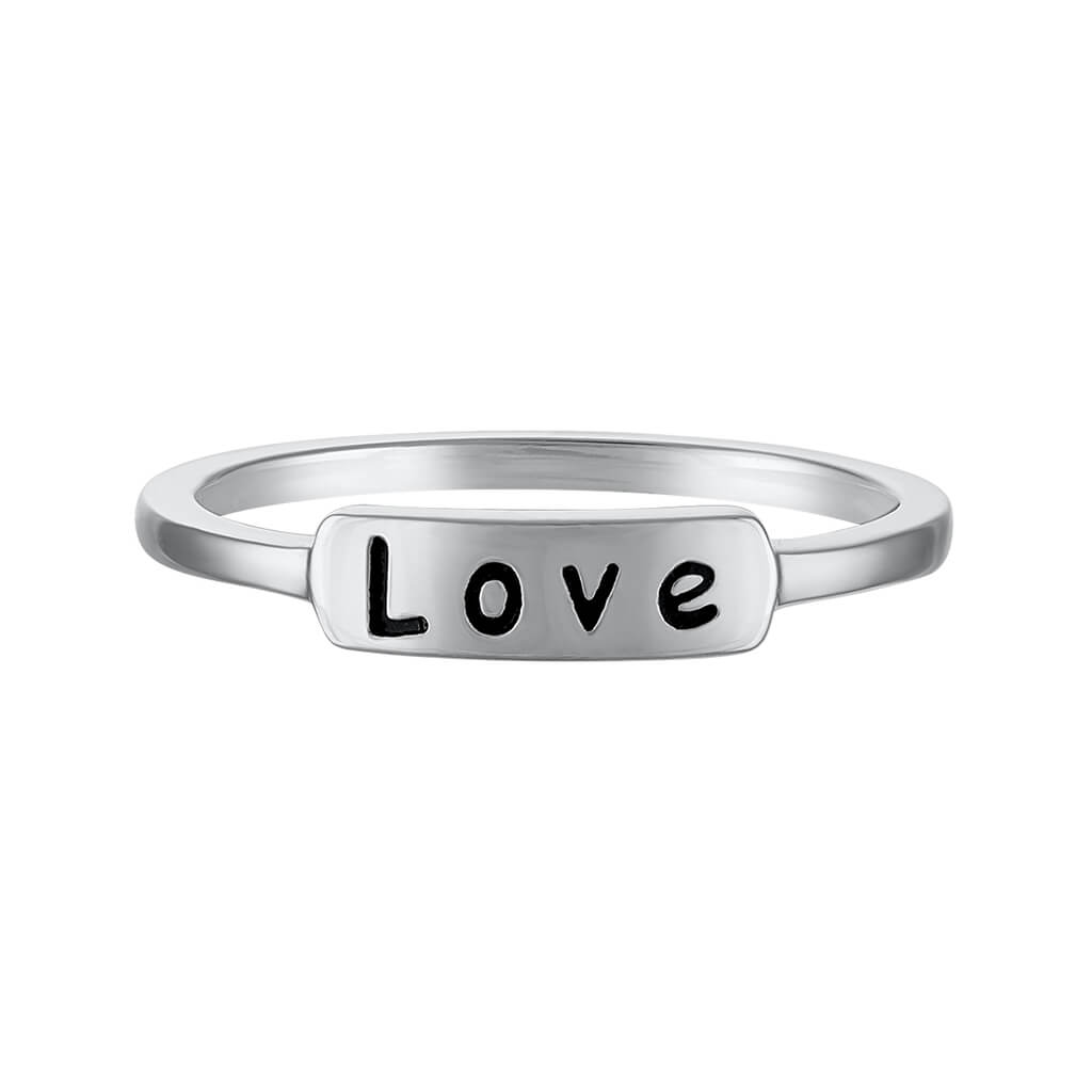 Close-up view of the 'love' engraving on a polished ring