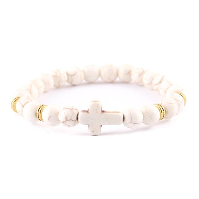 Cute Christian bracelet made of white marble beads with a subtle cross emblem
