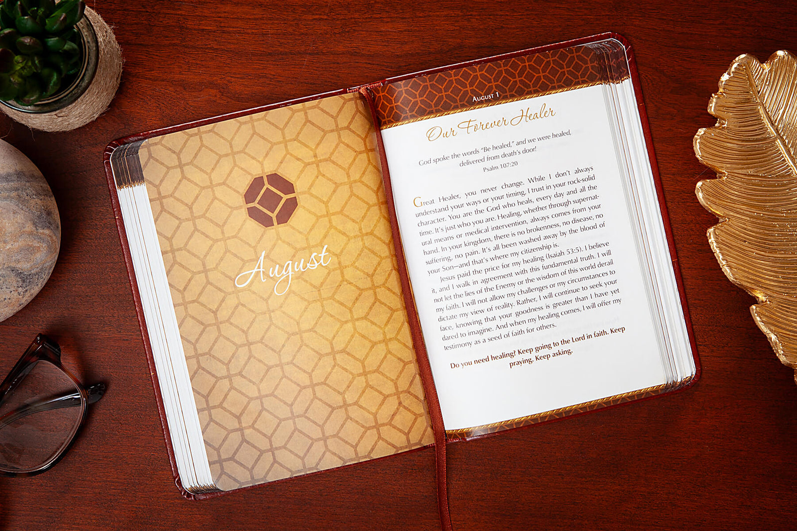 Red devotional titled 'Prayers on Fire for Men' on a wooden surface with decorative elements.