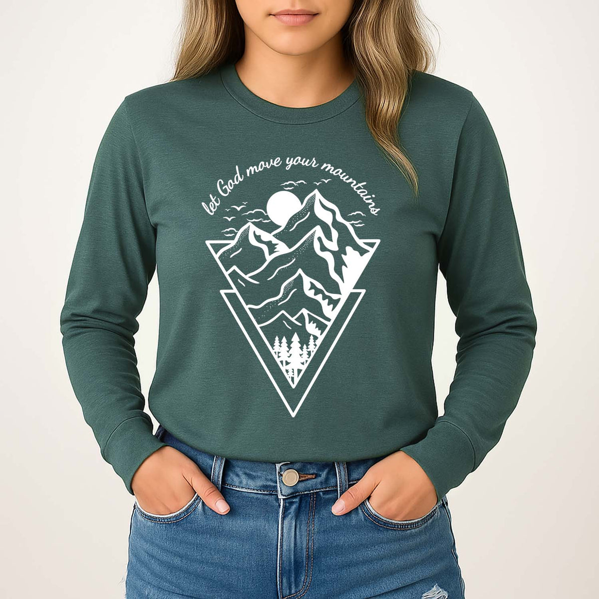 Green long sleeve with mountain graphic and encouraging Biblical text worn by a young woman