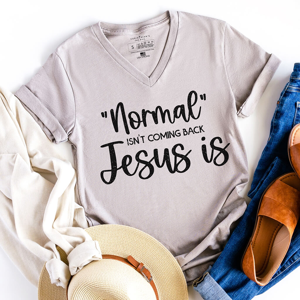 Normal isn't coming back Jesus is quote on a gray v-neck Christian shirt