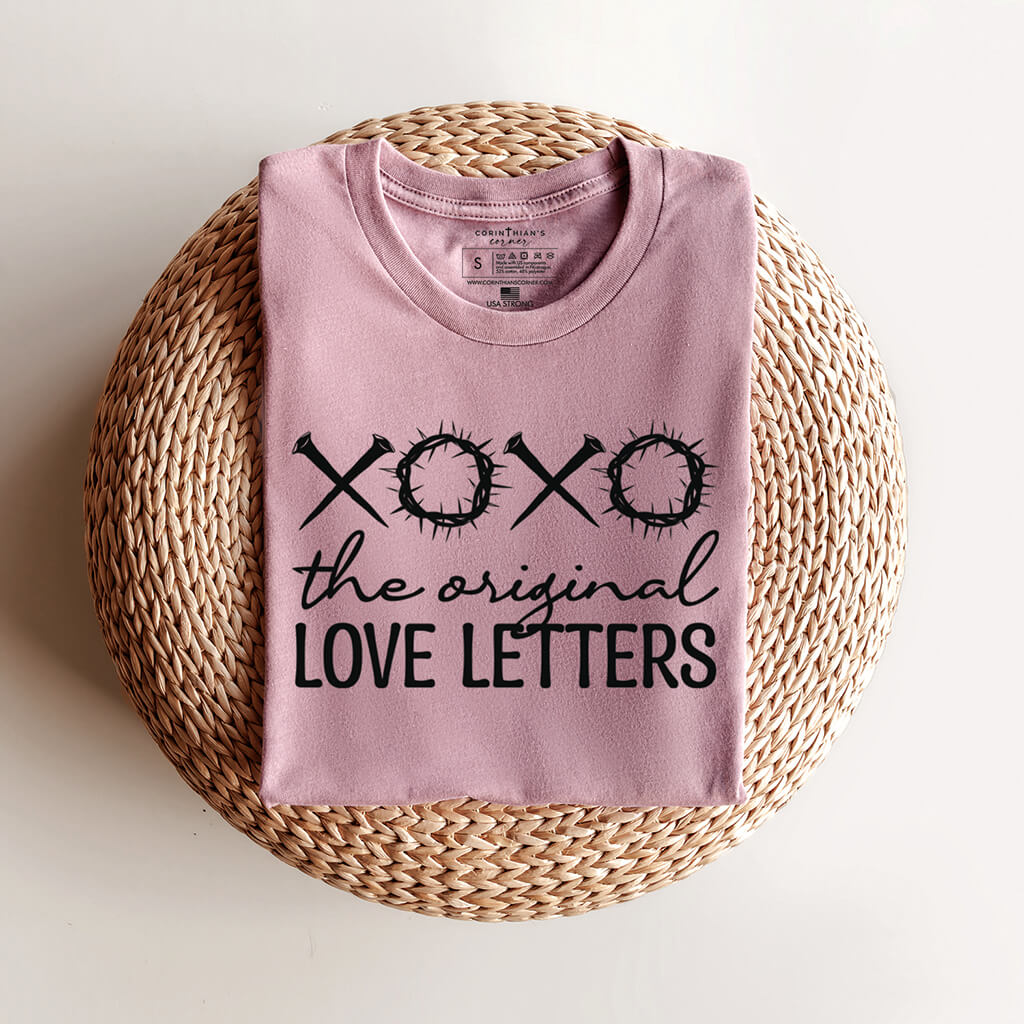 Original love letters shirt folded on top of a woven basket
