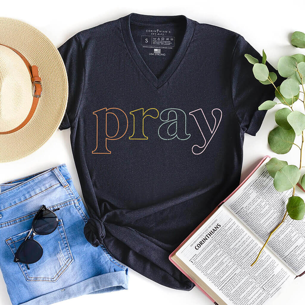 Multi-color Christian v-neck shirt that reads PRAY in neon pattern