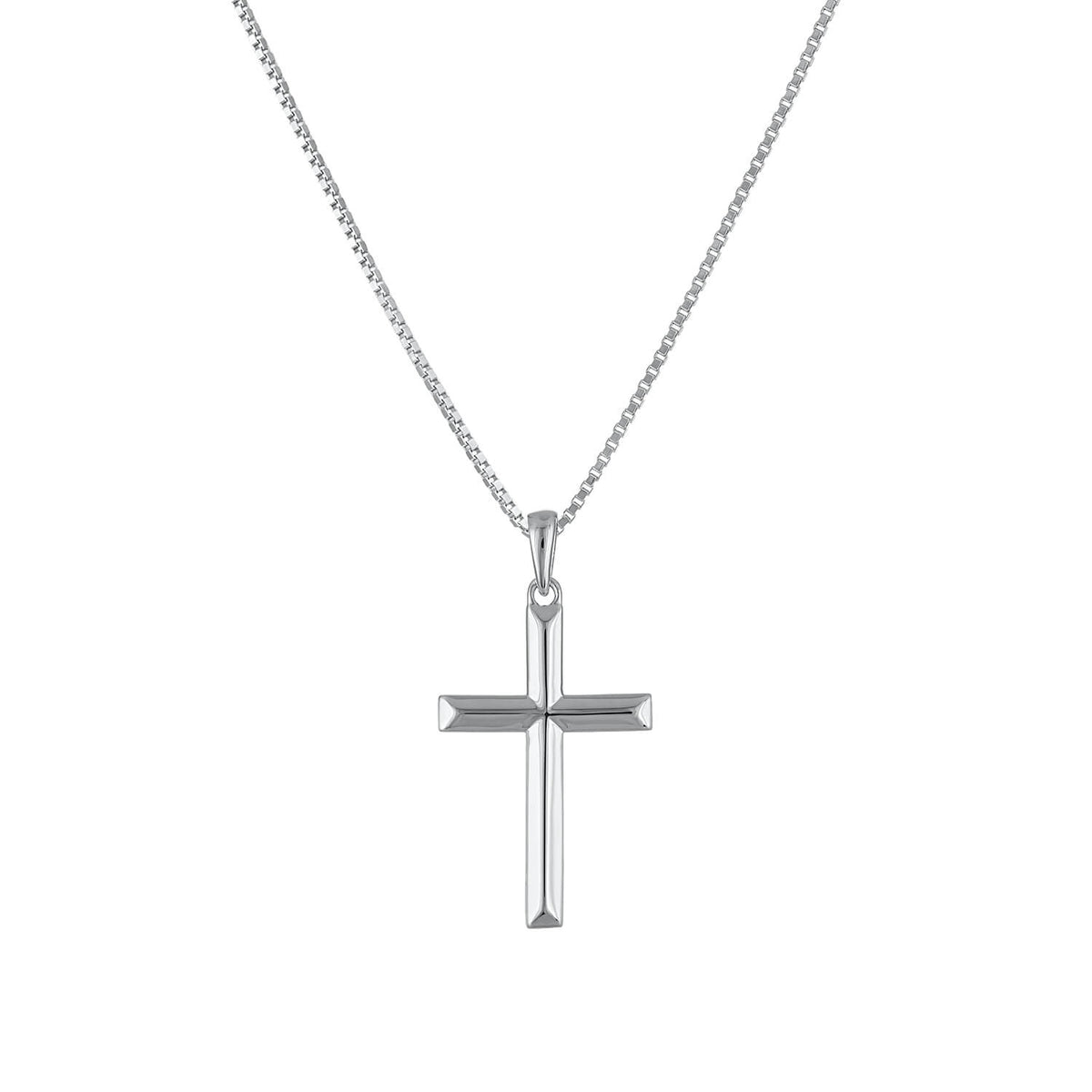 The Ridged Cross Necklace rises into the middle, adding depth and visual interest to the look
