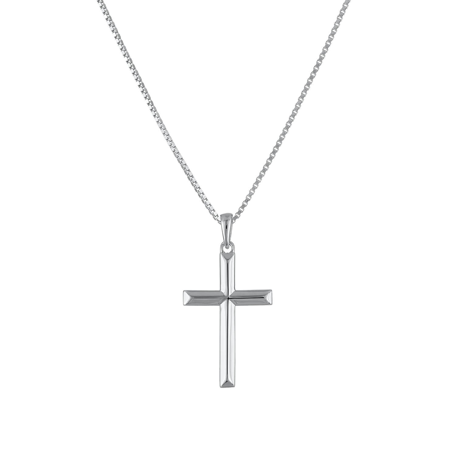 The Ridged Cross Necklace rises into the middle, adding depth and visual interest to the look