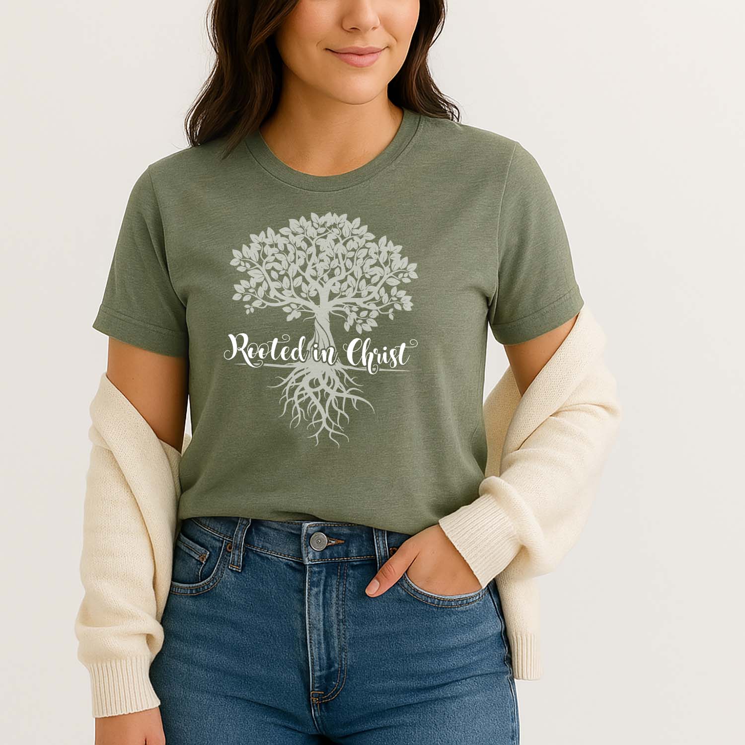 Olive green Christian top with a graphic tree of life design and rooted in Christ text