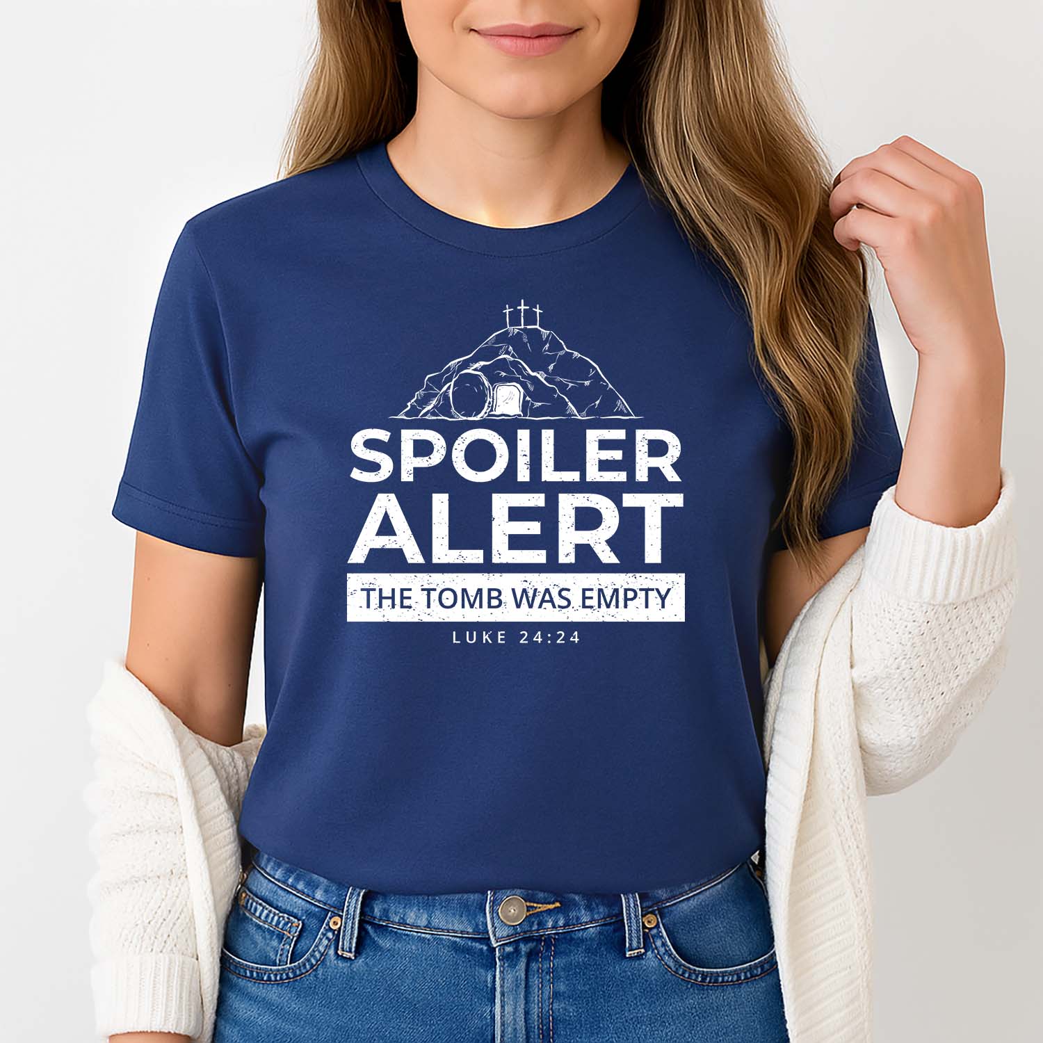 Graphic Easter t-shirt for women that reads spoiler alert the tomb was empty