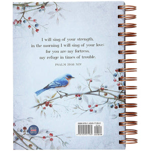 A spiral-bound notebook with a light blue cover featuring a watercolor-style bluebird perched on a branch with red berries, plus a printed Bible verse from Psalm 30:14. A Belle Isle logo appears near the lower left, and a barcode is visible near the lower right.