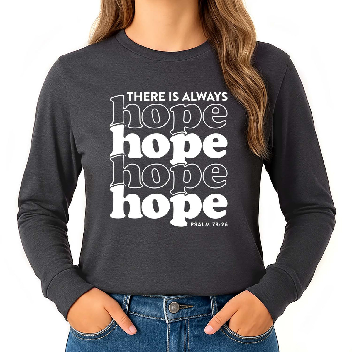 Girl wearing a 'there is always hope' shirt with Psalm 73:26 on a dark grey long sleeve shirt