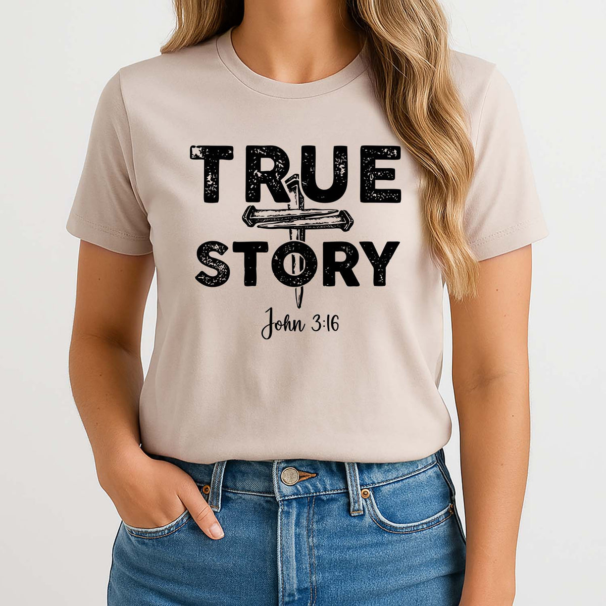 Woman wearing a beige t-shirt with 'TRUE STORY John 3:16' text design.