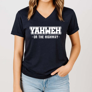 Woman wearing a black t-shirt with 'YAHWEH OR THE HIGHWAY' text on a plain background