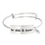 Stainless steel Christian bangle bracelet on white background