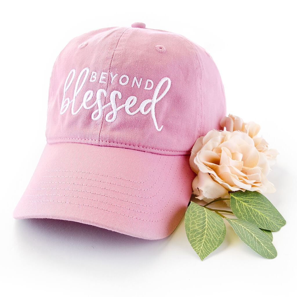 Pink dad hat with beyond blessed embroidered on the front
