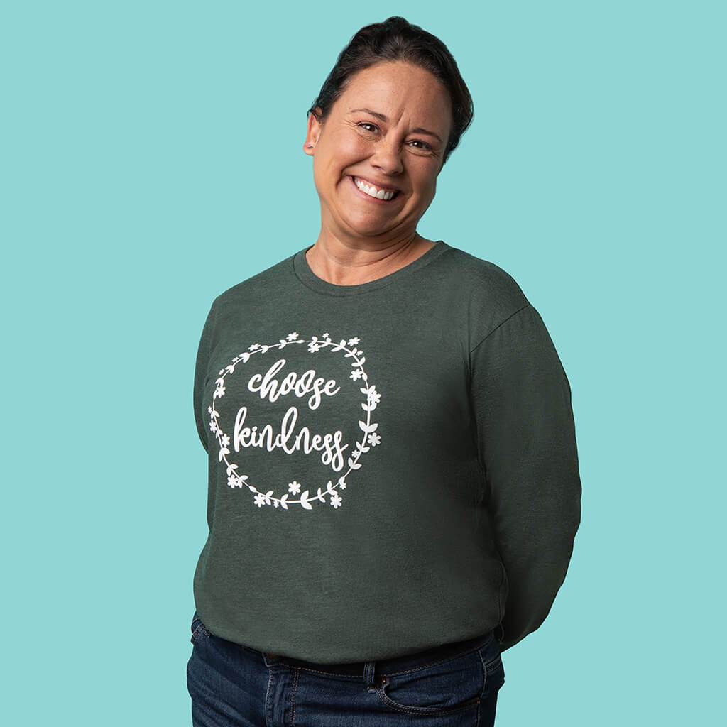 Uplifting choose kindness design on a green long sleeve top