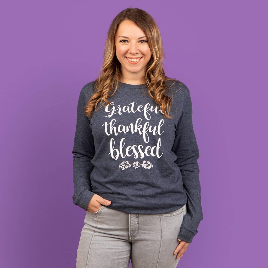 Grateful thankful blessed design on a navy long sleeve top