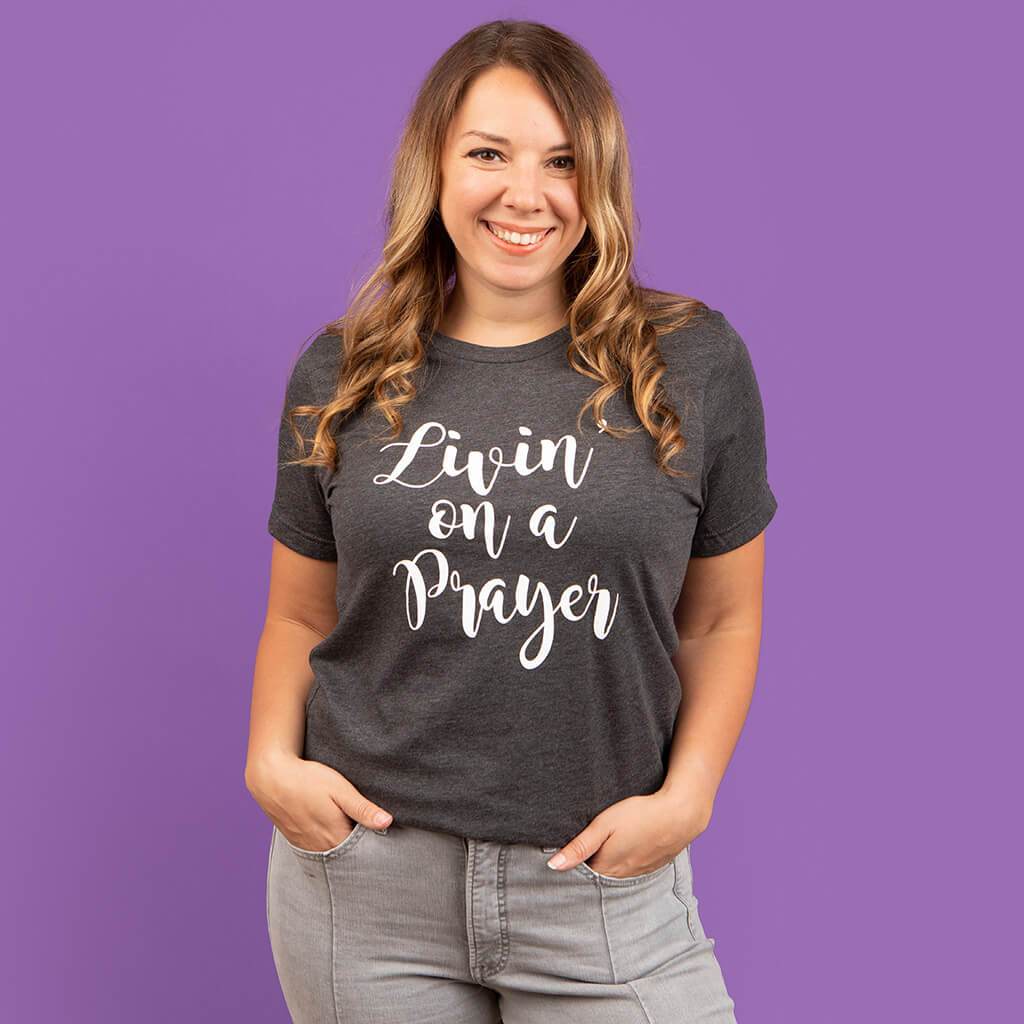 "Livin' on a prayer" printed on a premium gray women's Christian t-shirt