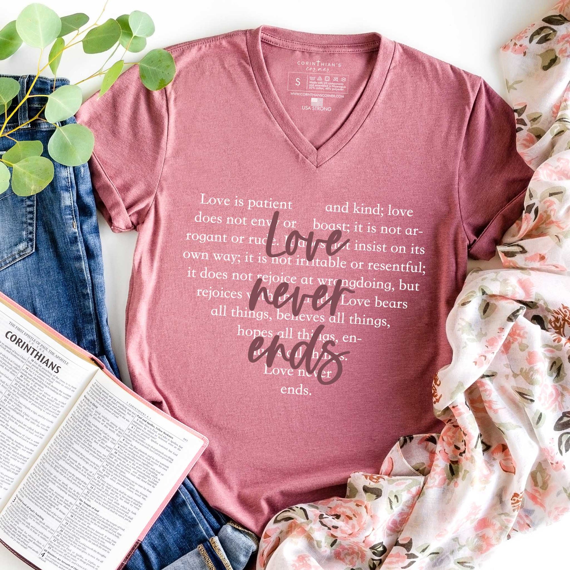Valentine's day v-neck shirt that reads love never ends with accompanying Bible passage