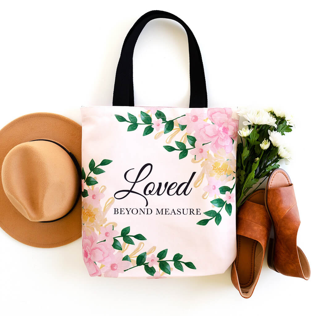 Christian tote bag with floral print and loved beyond measure text