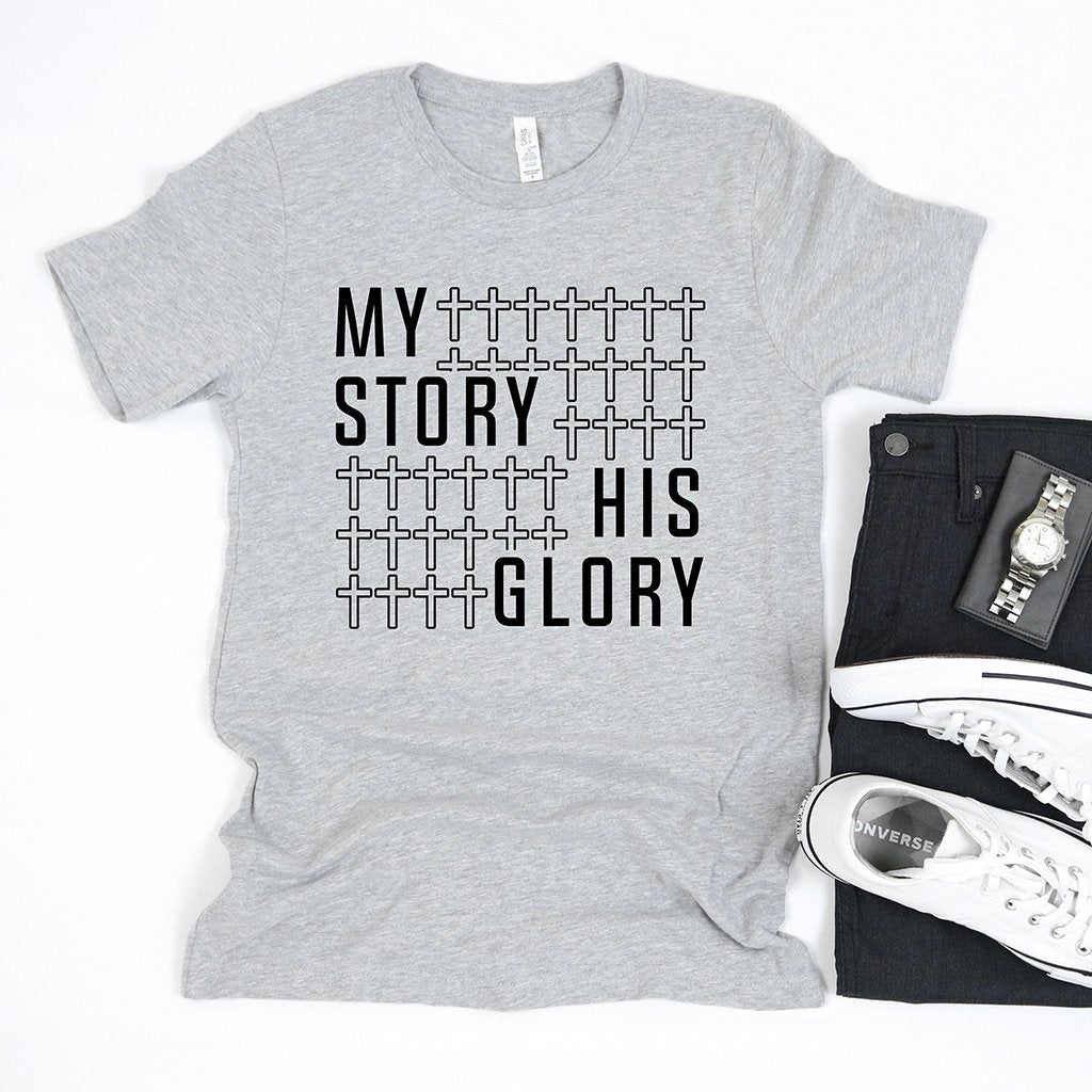 "My story his glory" with a cross pattern printed on a men's Christian t-shirt