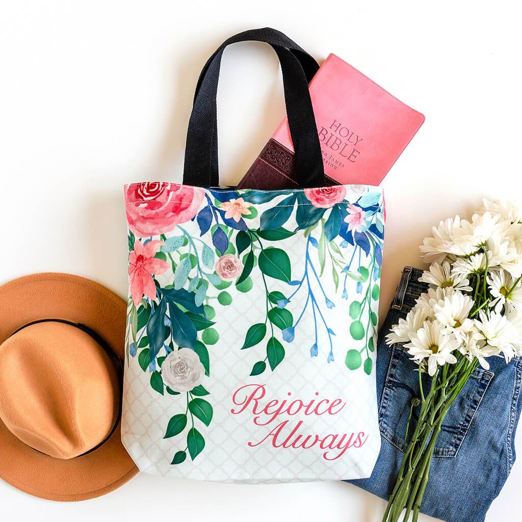 Biblical tote bag that reads rejoice always with vibrant pink accents