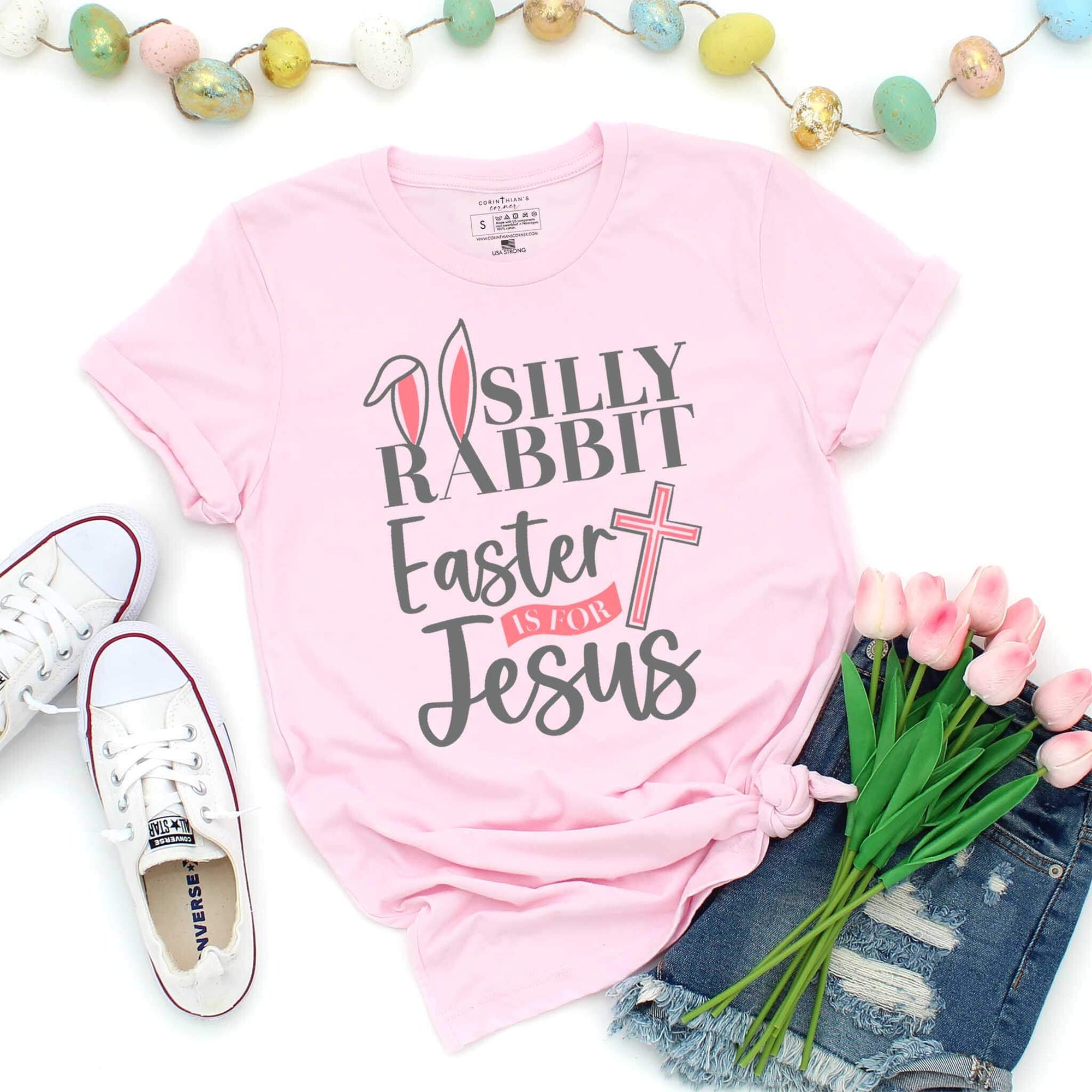 Pink faith-based shirt that reads silly rabbit Easter is for Jesus