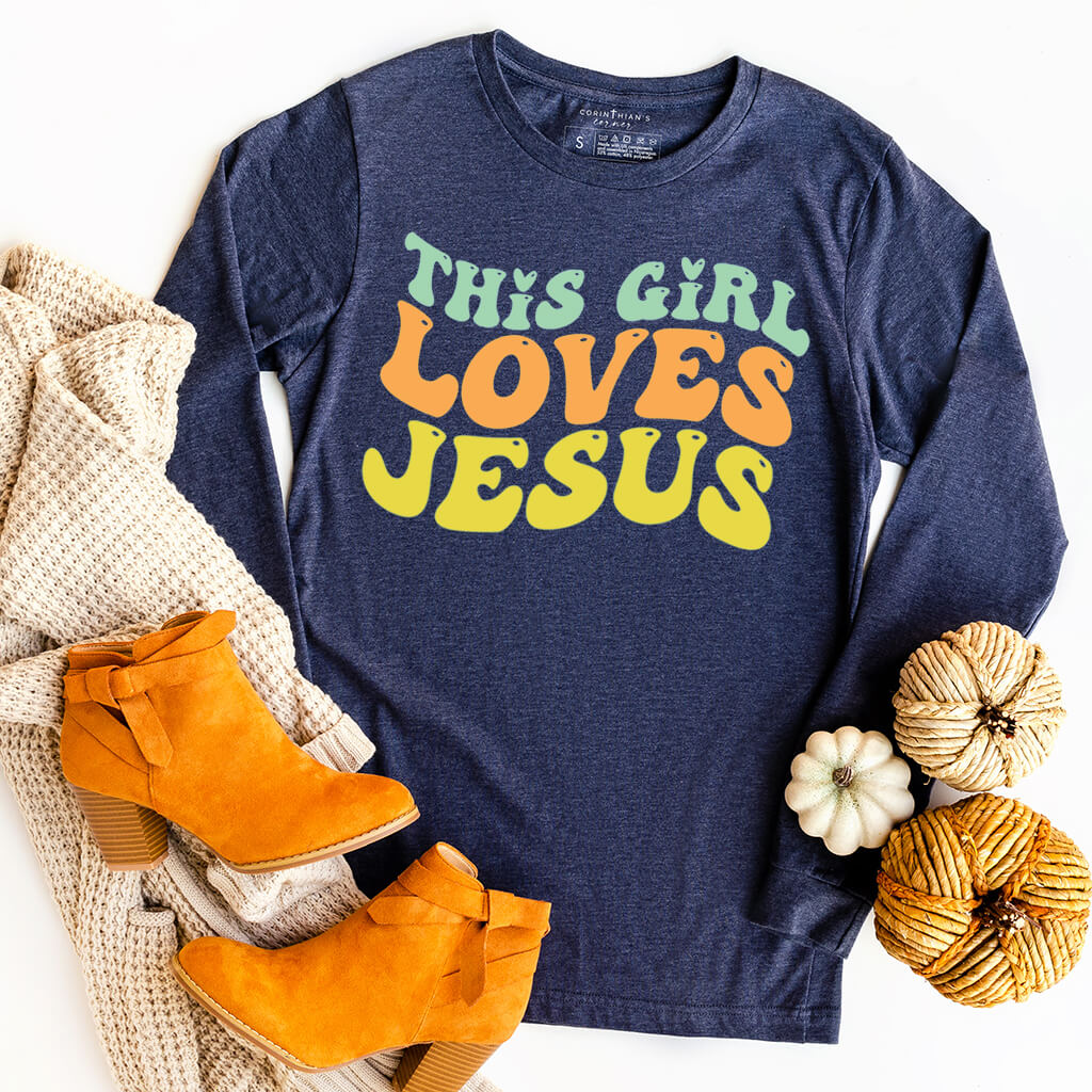 Colorful Christian long-sleeve shirt that says this girl loves Jesus