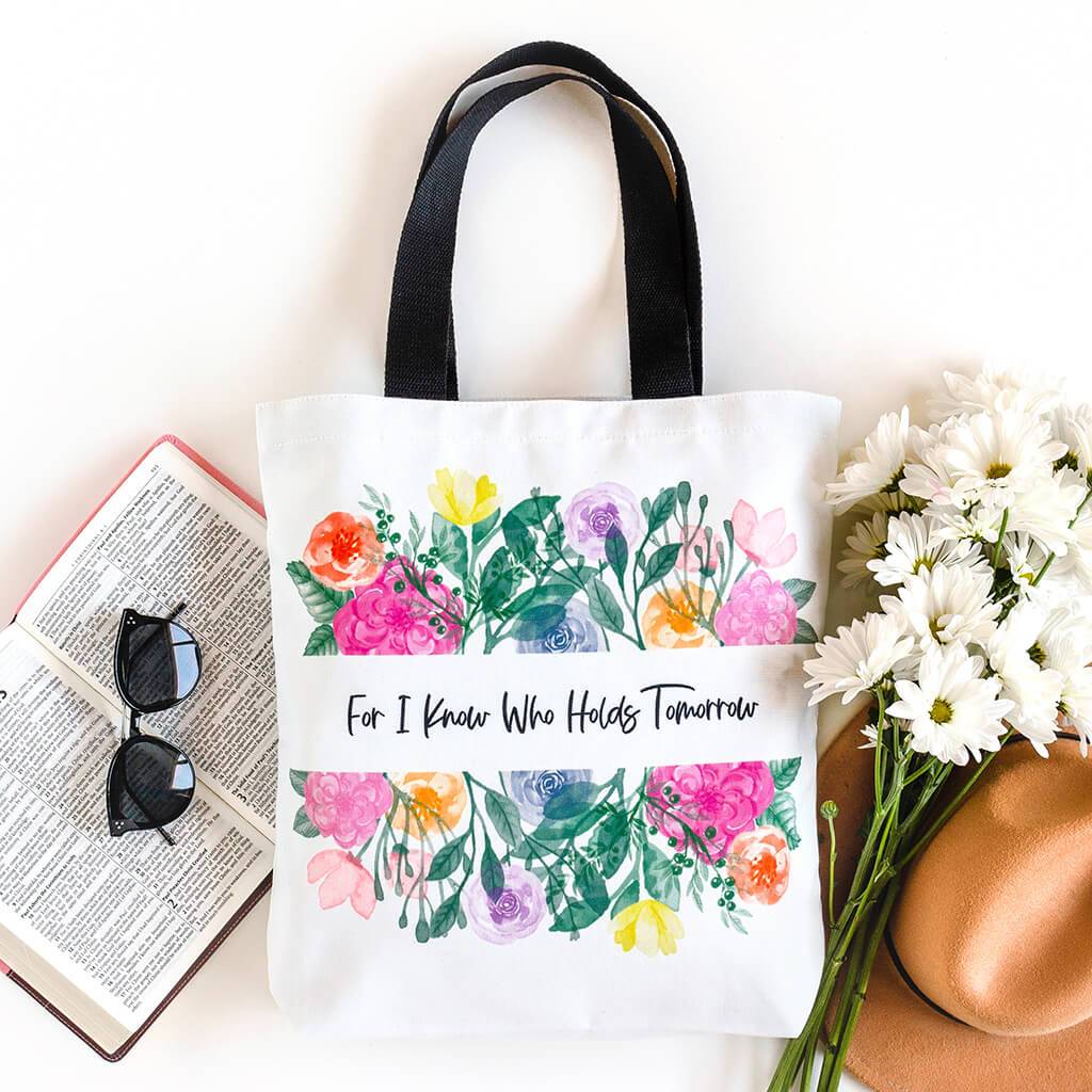 Floral Christian tote bag with inscription that reads For I Know Who Holds Tomorrow